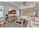 Comfortable living room with neutral decor, TV, and bright windows, creating a relaxing and inviting space at 10724 Spring Tide Way, Parrish, FL 34219