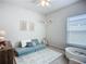 Bright bedroom featuring a large window, a play area and alphabet decor at 11015 High Noon Trl, Parrish, FL 34219