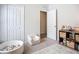 Bedroom with closet and shelving with an open door to the next room at 11015 High Noon Trl, Parrish, FL 34219