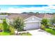 Charming single-story home with a well-manicured lawn and a two car garage at 11015 High Noon Trl, Parrish, FL 34219
