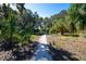 Walking trail provides a scenic escape through lush greenery at 11015 High Noon Trl, Parrish, FL 34219