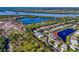 Aerial view of home on pond, with views of gulf, water, and marshland in the background at 11367 Perico Isle Cir, Bradenton, FL 34209