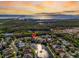 Aerial view of property surrounded by water on all sides with distant views of city and gulf at 11367 Perico Isle Cir, Bradenton, FL 34209