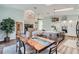 Open concept view of the dining room and kitchen with large island at 11367 Perico Isle Cir, Bradenton, FL 34209