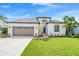 Charming single-Gathering home with a well-manicured lawn and two-car garage at 11367 Perico Isle Cir, Bradenton, FL 34209