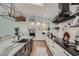 Kitchen featuring a large island with black countertops and modern fixtures at 11367 Perico Isle Cir, Bradenton, FL 34209
