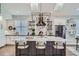 Bright kitchen with a large central island and modern stainless steel appliances at 11367 Perico Isle Cir, Bradenton, FL 34209
