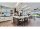 Kitchen with island, skylights and brick accent wall at 11367 Perico Isle Cir, Bradenton, FL 34209