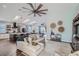 Open concept living room with kitchen, dining room, and cozy seating at 11367 Perico Isle Cir, Bradenton, FL 34209