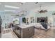 Open floor plan featuring kitchen island, dining area, and Gathering room at 11367 Perico Isle Cir, Bradenton, FL 34209