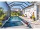 Enclosed pool area with inviting clear water and tiled accents at 11367 Perico Isle Cir, Bradenton, FL 34209