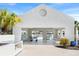 Outdoor recreation area featuring ping pong, seating, and a built-in grill at 11367 Perico Isle Cir, Bradenton, FL 34209