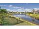 Scenic water view featuring a fountain and surrounding homes in a well-manicured community at 11367 Perico Isle Cir, Bradenton, FL 34209