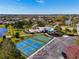 Aerial view of community amenities featuring tennis courts, pool, and playground at 11455 52Nd E Ct, Parrish, FL 34219
