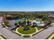 Aerial view of community pool, tennis courts, playground, and surrounding residential area at 11455 52Nd E Ct, Parrish, FL 34219