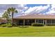 Lush backyard with screened patio and manicured landscaping at 11455 52Nd E Ct, Parrish, FL 34219