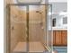 Detailed view of the shower enclosure with tile and fixtures in the primary bathroom at 11455 52Nd E Ct, Parrish, FL 34219