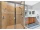 Bright bathroom features tile floor, glass-enclosed shower, and double sink vanity at 11455 52Nd E Ct, Parrish, FL 34219
