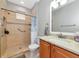 Accessible bathroom featuring a walk-in shower with grab bars and a modern single sink vanity at 11455 52Nd E Ct, Parrish, FL 34219