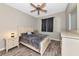 Relaxing bedroom with wood-look flooring, ceiling fan, and a neutral color scheme for a calming atmosphere at 11455 52Nd E Ct, Parrish, FL 34219