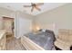 Comfortable bedroom featuring neutral colors, wood-look floors, and access to closet space for easy storage at 11455 52Nd E Ct, Parrish, FL 34219
