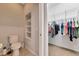 Spacious walk-in closet with built-in shelving and ample hanging space for storage and organization at 11455 52Nd E Ct, Parrish, FL 34219