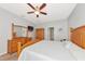 Comfortable bedroom with decorative wooden furniture and ceiling fan at 11455 52Nd E Ct, Parrish, FL 34219