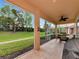 Covered patio with dining set and backyard view at 11455 52Nd E Ct, Parrish, FL 34219