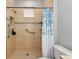 Large walk-in shower featuring stylish tile, grab bars, and convenient shelf, adding safety and luxury at 11455 52Nd E Ct, Parrish, FL 34219