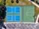 Overhead view of green basketball and blue pickleball courts near parking area at 11455 52Nd E Ct, Parrish, FL 34219