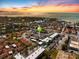 Breathtaking aerial view of the property with beautiful water views and a colorful sunset backdrop at 116 Vista Hermosa Cir # 204C, Sarasota, FL 34242