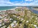 Breathtaking aerial view of waterfront community showcasing stunning coastline and luxurious homes at 116 Vista Hermosa Cir # 204C, Sarasota, FL 34242