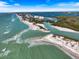Gorgeous aerial view of the coastline with sandy beaches and turquoise waters, perfect for a relaxing vacation at 116 Vista Hermosa Cir # 204C, Sarasota, FL 34242