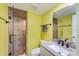 Bathroom featuring walk in shower with glass door, granite counters and bronze fixtures at 116 Vista Hermosa Cir # 204C, Sarasota, FL 34242