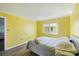 Bedroom featuring a bed, window, and doorway to another room at 116 Vista Hermosa Cir # 204C, Sarasota, FL 34242