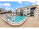 Inviting community pool area with ample seating, lush landscaping, and well-maintained surroundings at 116 Vista Hermosa Cir # 204C, Sarasota, FL 34242