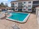 Inviting community pool area with ample seating, lush landscaping, and well-maintained surroundings at 116 Vista Hermosa Cir # 204C, Sarasota, FL 34242