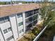 Exterior of building featuring screened lanais with views of greenery, a very attractive design at 116 Vista Hermosa Cir # 204C, Sarasota, FL 34242
