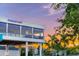 Distant shot of the Daiquiri Deck, an outdoor restaurant at sunset at 116 Vista Hermosa Cir # 204C, Sarasota, FL 34242