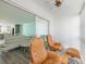 Comfortable living room/sunroom with modern furnishings, slider and great views at 116 Vista Hermosa Cir # 204C, Sarasota, FL 34242