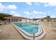 Inviting community pool with clear blue water and poolside seating, perfect for relaxing and enjoying the Florida sunshine at 116 Vista Hermosa Cir # 204C, Sarasota, FL 34242