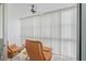 Light-filled sun room with vertical blinds, ceiling fan and great views at 116 Vista Hermosa Cir # 204C, Sarasota, FL 34242