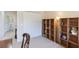 Bedroom features a closet and two large shelving units for storage and organization at 12007 Clubhouse Dr, Lakewood Ranch, FL 34202