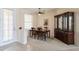 Formal dining area with classic furnishings, including a dark wood table and china cabinet at 12007 Clubhouse Dr, Lakewood Ranch, FL 34202
