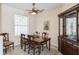 Formal dining room includes a wood table, seating for six, and an ornate china cabinet at 12007 Clubhouse Dr, Lakewood Ranch, FL 34202