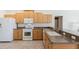 Functional kitchen with light wood cabinets and modern appliances at 12007 Clubhouse Dr, Lakewood Ranch, FL 34202