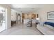 An open floor plan with tile floors combines the living and dining areas with a view to the kitchen at 12007 Clubhouse Dr, Lakewood Ranch, FL 34202