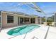 A beautiful screened-in pool in the backyard of a lovely home with a seating area at 12007 Clubhouse Dr, Lakewood Ranch, FL 34202