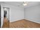 Spacious bedroom features wood floors and neutral walls at 12214 Streambed Dr, Riverview, FL 33579