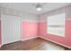 Traditional style bedroom with white closet doors and a window with horizontal blinds at 12214 Streambed Dr, Riverview, FL 33579